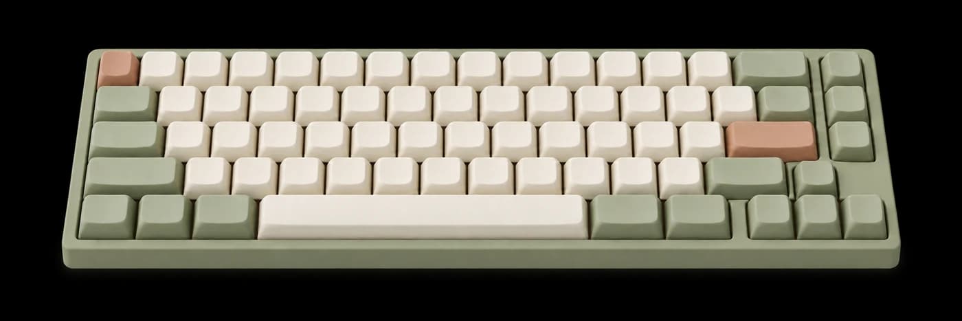 Illustration of a wide mechanical keyboard with ivory, sage green and terracotta keycaps.